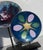 A beautiful pair of two enamels on display stands. steel mounts hold the glossy enamels up as fine abstract disks of...