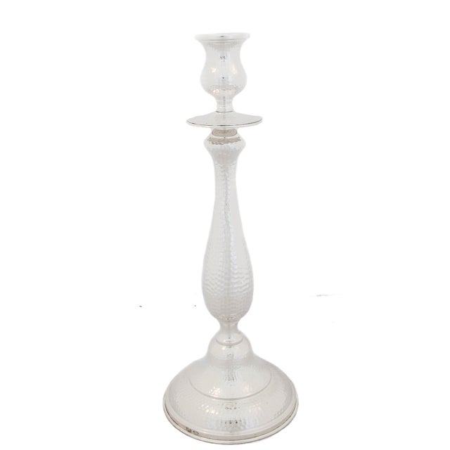 Being offered is a pair of sterling silver hand-hammer candlesticks. They are exceptionally tall and have a classic shape....