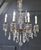French Crystal 6-Arm Chandelier in Brass, 1920 For Sale - Image 8 of 9