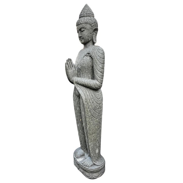 Standing vintage stone carved Buddha statue. Wonderful for outdoor or indoor display. Peaceful expression with hands in...
