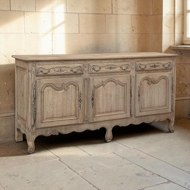 18th Century Country French Louis XV Buffet in Stripped Oak is a beautiful work of the cabinetmaker's art, hand-stripped...