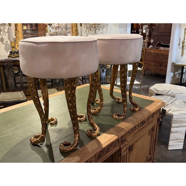 This product is a pair of Italian heavy gilt iron octopus benches with white upholstery. So unique and interesting. Sure...
