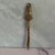 Handsome vintage mid-century letter opener. Made of brass with hanging hook at top for display. Features a perching owl.