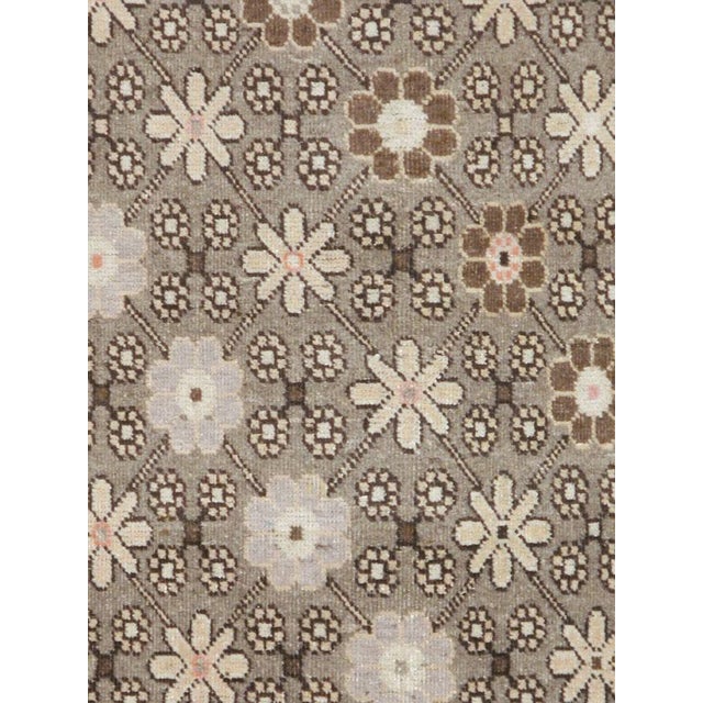 An antique East Turkestan carpet from the second quarter of the 20th century.