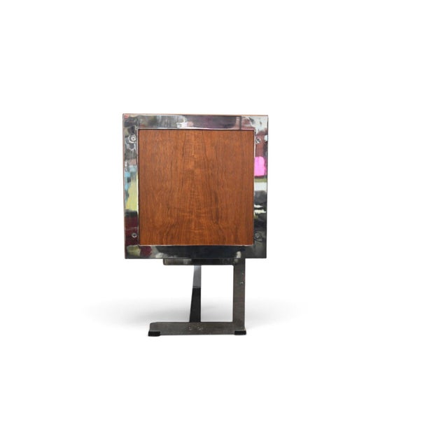 This rare credenza was designed by Richard Round and produced by Merrow Associates in England during the 1970s. The teak...