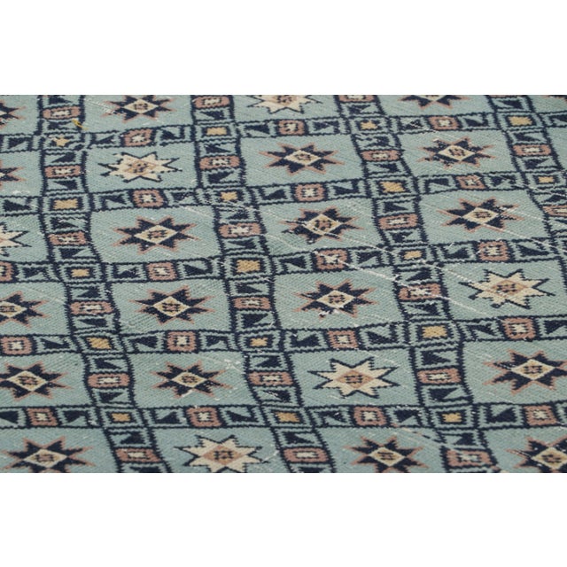 Made with hand-knotted wool in Turkey circa 1950-1960, this 4x7 vintage rug is an exciting new mid-century curation from...