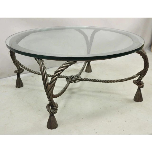 Vintage Italian Hollywood Regency Steel Knotted Rope and Tassel Round Glass Coffee Table. Item features heavy high quality...