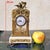 Small bronze and white marble clock in the Louis XVI style: richly ornamented with finely chased bronze garlands of...