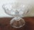 A beautiful English cut crystal footed compote with wide base and oval bowl. Measures 9 5/8" x 7 1/2" x 7 1/2" tall....