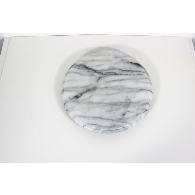 Vintage Italian Carrera marble lazy Susan. This has lovely patina, scratches, marks and wear on the edges. 12” 1.25” tall