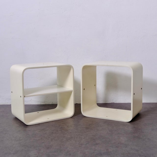 Two white lacquered wood bookcases, created by Italian architect and designer Carlo de Carli between the late 1960s and...