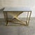 Sculptural console table with a frame featuring an arrangement of gilt metal linear elements, composed in a dynamic,...
