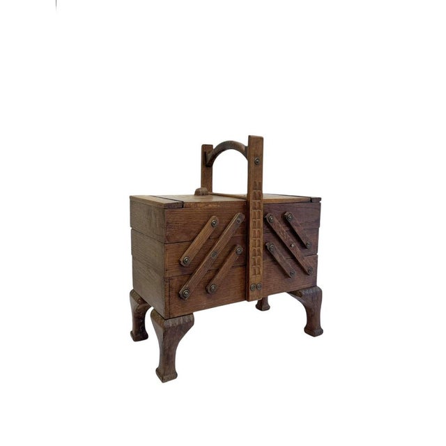 Heavy oak sewing box with a so-called accordion-style mechanism. Made in the 1950s in the Netherlands. Beautifully...