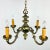 Pair of elegant early 20th Century bronze art nouveau chandeliers. Solid cast bronze with 4 substantial arms featuring...