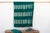 A rare regional variation of West African indigo, featuring saturated teal-green hues and hand-stitched details. This...