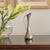 Lovely decorative silver plated bud vase from France, 1930s. Sculptural shape with fluted rim and and handle detail....