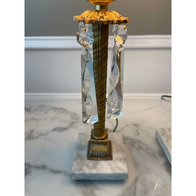 Add a touch of distinction with these Antique brass and crystal lamps. Quality pieces with Carrera marble bases with brass...