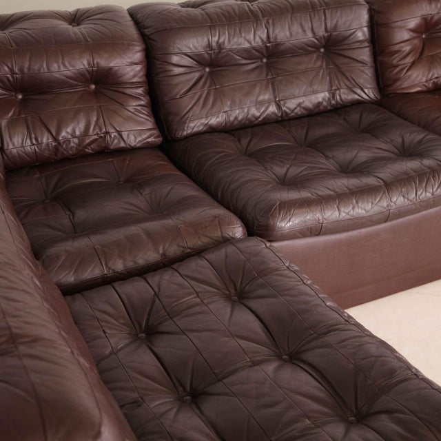Rare patchwork leather corner sofa by Laauser, circa 1970. Composed of five modules that can be arranged as desired, this...