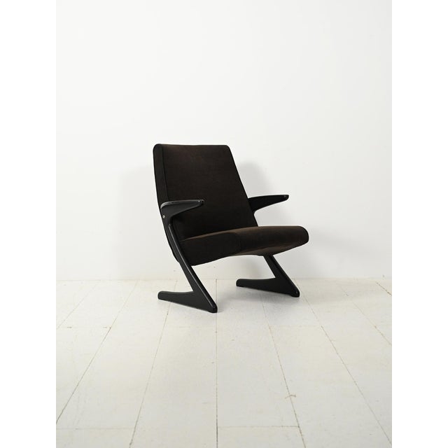 Swedish armchair, model "z," from the 1960s, with a dark lacquered geometric frame and black velvet upholstery. the model...