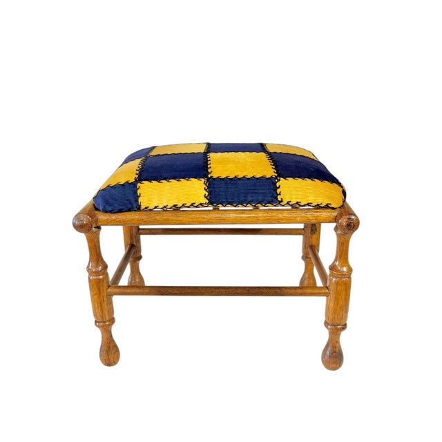 Charming antique French Provincial footstool crafted from warm-toned walnut, featuring elegantly hand-turned legs and...