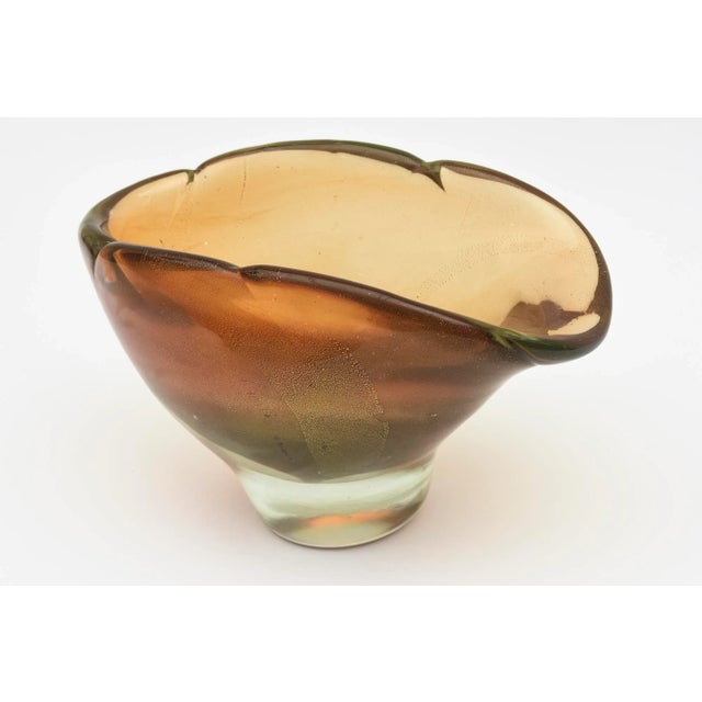 This stunning and thick walled vintage mid century modern Italian Murano glass bowl is by the glass masters Barovier e...
