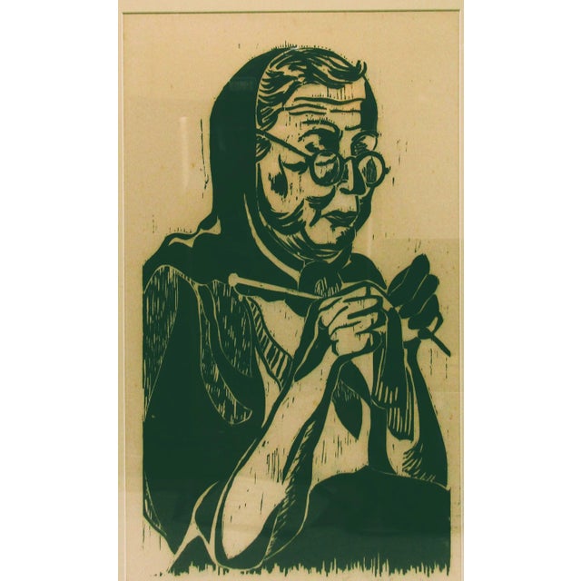 Signed and Framed Karen McCann 1963 Woodcut Print of Woman Knitting Overall measures 20 1/4" wide, 30 3/4" tall and 1 1/2"...