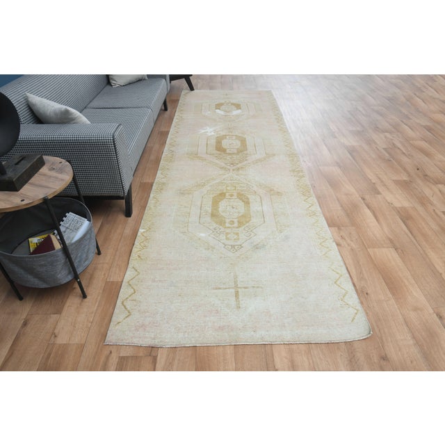 This vintage hand-knotted area rug is a semi-antique vintage area rug. The '70s Eastern region of Anatolian's unique rug...