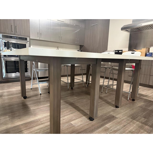 Beautiful quartz table. Base: Stained Alder base with casters Top: Arizona Tile Radianz Quartz in Everest White Two (2)...