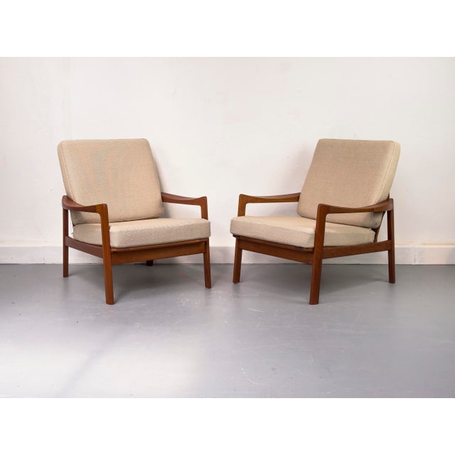 Elegant and rare teak armchairs (Model 69) made in Norway by Gustav Bahus, designed by Tove & Edvard Kindt-Larsen. The...