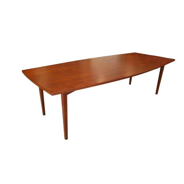 A formidable Danish teak dining table from A/S Polexim Co. in Copenhagen, a table with room for the whole family! with its...