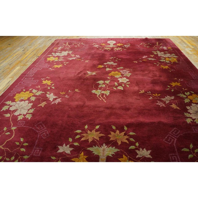 Antique Room Size Wool Red Rug, Country of Origin: China, Circa Date: 1920s. This magnificent example of early 20th-...