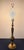 A striking mid-century modern table lamp executed in heavy cast brass with an elegant Asian Chinoiserie silhouette. The...