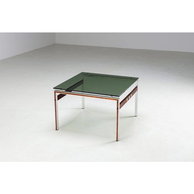 Scandinavian square coffee table in aluminium, teak and rosewood with smoked glass top, Denmark 1960s. A striking...