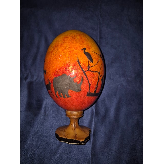 This decorative piece is an authentic African wildlife safari scene hand-painted onto what I assume is a real ostrich...