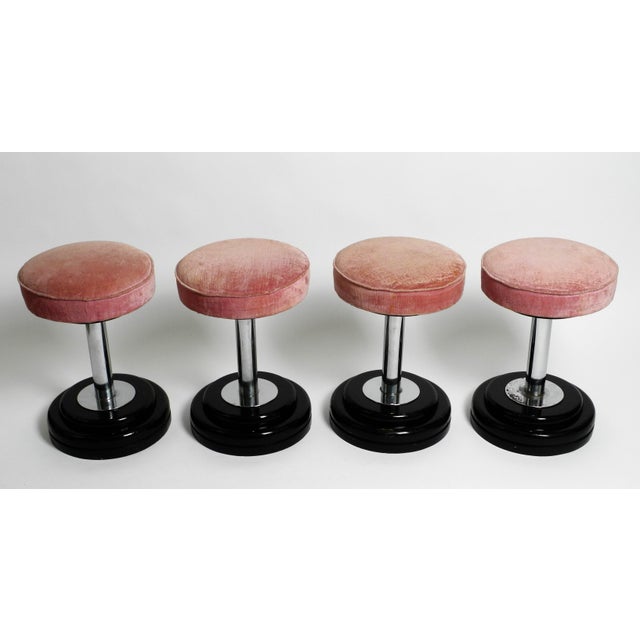 Stunning set of four Stools in Art Deco Style. Likely manufactured circa 1950. Heavy wooden base. Chrome-plated steel...