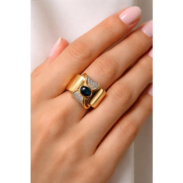 18k Yellow Gold Ring with oval cut 1.05 carat blue sapphire and round cut diamonds weighing 0.45 carats. Size 6.5...