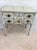 Over the top vanity table with a lift top mirror and fold up sides. The painted finish is in great condition. The top has...