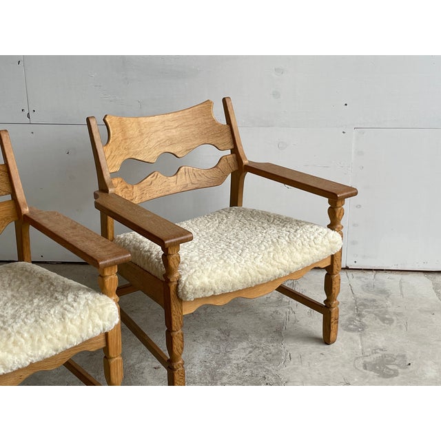 A rare and coveted pair of Henning Kjærnulf (Kjaernulf) "Razorblade" lounge armchairs — among the most sought-after...