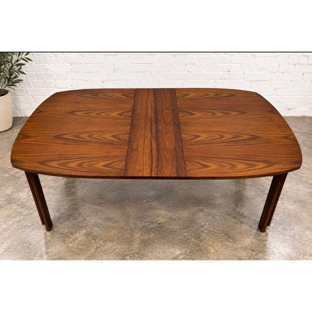 Stunning super rare walnut brutalist style Tabago Canada dining table with to extension leaves. This piece has fantastic...