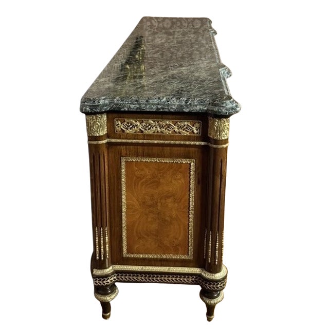 This monumental Louis XVI style commode makes a commanding statement in a dining room, entry hall or long living room...