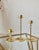 Excellent Pre-Owned Condition. Fabulously sleek trio of graduated brass and lead crystal tulip candlesticks made in Hong...