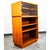 2 piece Danish teak bookshelf cabinet with 2 doors glass display that sits above. Unsigned example.