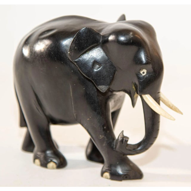 Ebony Wood Hand Carved Anglo Indian Elephant Sculpture. Gorgeous vintage black hand carved wood ebony Anglo-Indian...