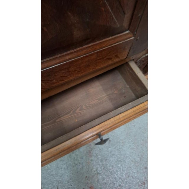 Small Louis XIII style solid oak wardrobe, 19th century. This wardrobe has two drawers and three shelves. The key and lock...