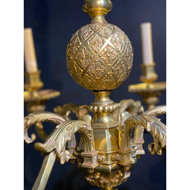A circa 1900’s Caldwell Neoclassic gilt bronze engraved chandelier with 6 lights