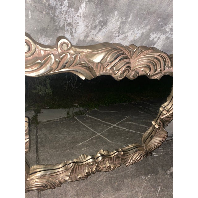 "This mirror features a beautifully defined, deeply contoured 1970s frame cast in a high-grade Fiber Reinforced Polymer...