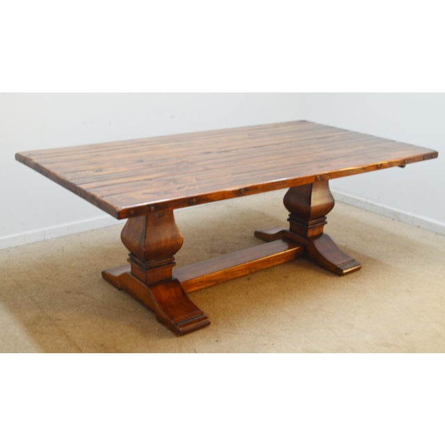 Dining Table by Ralph Lauren. Store item #552. It features trestle base and solid wood construction .