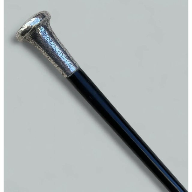 Fine Quality French polished Ebony Lady’s or Gentleman’s Walking Cane with a highly decorative embossed Sterling Silver...