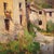 Italian painting from the first half of the 20th century. Oil on board artwork depicting a landscape, a view of a village...
