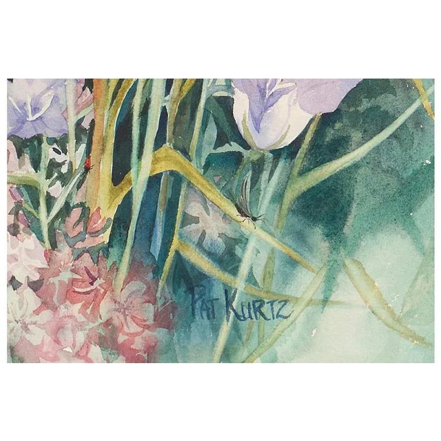 A substantial botanical watercolor study of daisies, bellflowers, and verbena shown in full bloom, with finely painted...